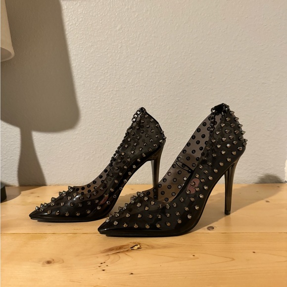 Shoes - Black spiky high heels.it comes with a chain goes around the ankle.